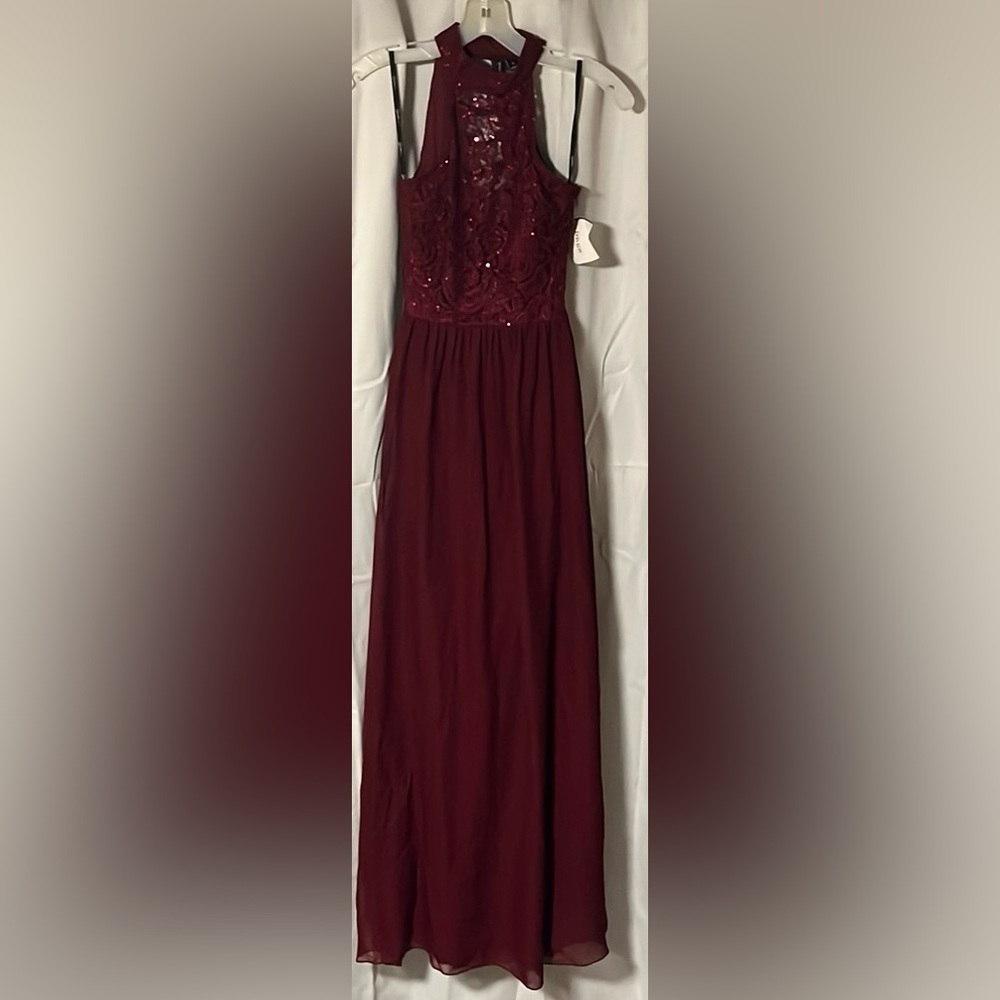 Never worn Size 1 Maroon dress perfect for a wedding or prom…